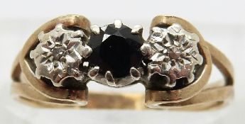 A 9ct gold ring set with a sapphire and two diamonds,