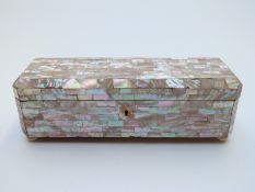 Mother of pearl glove or jewellery box raised on pad feet,