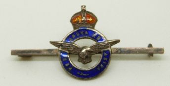 A silver RAF brooch reading 'per ardua ad astra' (through adversity to the stars) with blue enamel