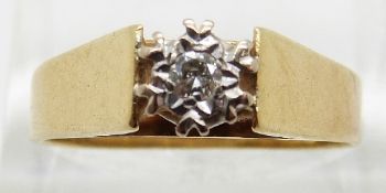 An 18ct gold ring set with a diamond in a platinum illusion setting,