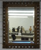 A 19thC giltwood mirror with bevelled glass 65cm x 51cm