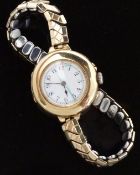 Swiss 15ct gold ladies wristwatch with blued hands, Arabic numerals,