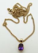 A 9ct gold pendant set with an oval amethyst on a 9ct gold chain, 3.