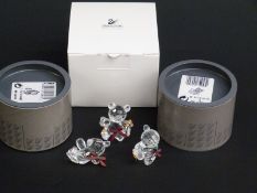 Three Swarovksi Crystal Bears all with ribbon and gilt decoration, largest 4.