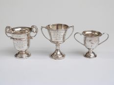 Three small hallmarked silver trophies, height of tallest 7cm,