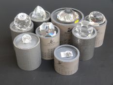 Eight Swarovski Crystal cut glass paperweights, largest 8cm in diameter,
