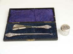 Cased hallmarked silver handled shoe horn and button hook together with a silver topped cut glass