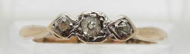 A 9ct gold ring set with three diamonds in a platinum setting