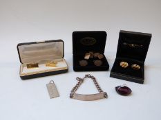 Four pairs of cufflinks, silver identity bracelet,
