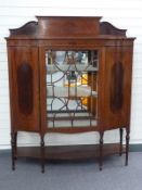 Edwardian inlaid mahogany display cabinet with glazed central door flanked by serpentine fronted