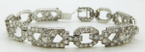 An Art Deco platinum bracelet of ten alternating octagonal and rectangular panels set with diamonds,