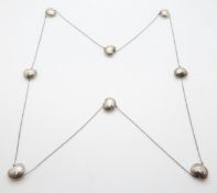 A bespoke silver necklace made up of kidney bean shaped links