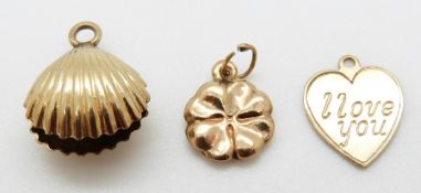 A 9ct gold I love you pendant/ charm and two yellow metal charms, 3.