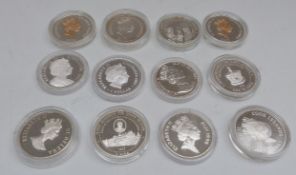 Silver Royal Commemorative crown sized coins in capsules,