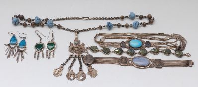 A white metal bracelet marked 800 set with a blue cabochon and neillo decoration,