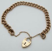 A 9ct rose gold curb link bracelet with heart padlock clasp, 11.