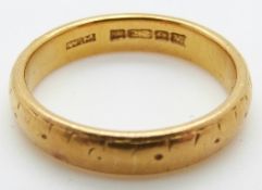 A 22ct gold wedding band, size N, 5.
