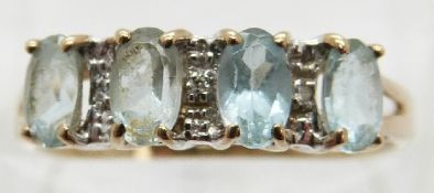 A 9ct gold ring set with topaz and diamonds,