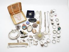 A collection of silver jewellery including twelve rings, bangles including Christening examples,