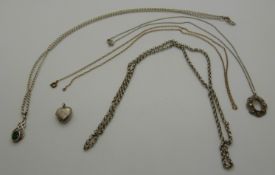 A silver belcher chain, silver heart locket,