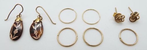 A pair of inlaid yellow metal earrings and two pairs of 9ct gold earrings, 1.