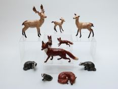 Ten Beswick wild animals to include a complete badger family, foxes,