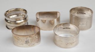 Five various hallmarked silver napkin rings including an engine turned example,