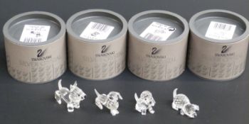Four Swarovksi Crystal Dogs Terrier, Dachshund, Beagle and Beagle Playing, largest 5cm long,