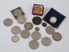 An 1885 silver dollar, crowns, silver £1 coin,