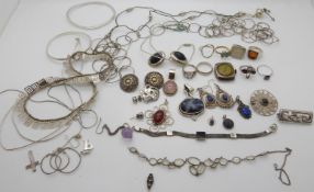 Three silver pendants, seven silver rings, three pairs of silver earrings, silver brooch,