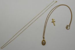 An 18ct French gold pendant set with a diamond on an 18ct gold chain, 4.3g and a 9ct gold cross, 0.