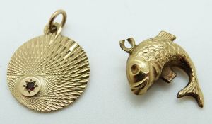 A 9ct gold pendant set with a garnet and a 9ct gold fish pendant, 3.