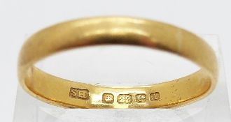 A 22ct gold wedding band, size X, 4.