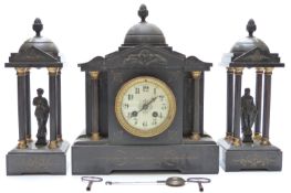 A 19thC slate mantel clock garniture in Romanesque classical architectural design,