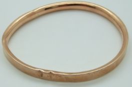 A 9ct rose gold flapper bangle, 13.