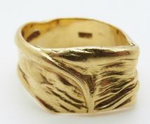 An 18ct gold ring in an abstract textured V design, maker LLB, size Q/R, 11.