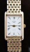 Rotary 9ct gold ladies wristwatch with gold hands, black Roman numerals, white face and ETA 280.