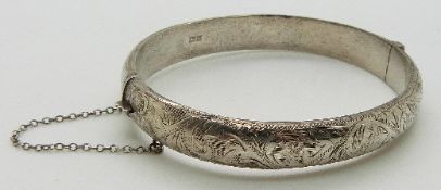 L & Co hallmarked silver bangle with engraved foliate design