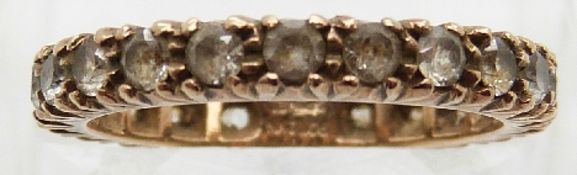 A 9ct gold eternity ring set with synthetic spinel,