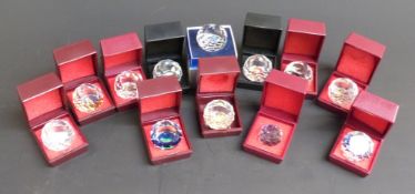 Twelve Swarovski Crystal cut glass paperweights