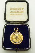 A 9ct gold Gloucestershire football fob in original box with enamel decoration, 5.