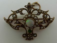 A 9ct gold Edwardian pendant/ brooch set with a round opal cabochon and seed pearls, 4.