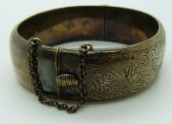 Liberty & Co hallmarked silver bangle with engraved foliate design,