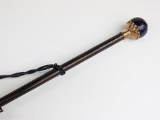 A 19thc/20thC parasol with spherical porcelain handle on yellow metal mount and collar decorated