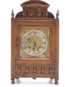 Mahogany cased late 19thC mantel clock, the case decorated with half turned spindles,