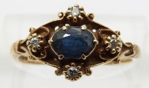 A 9ct gold ring set with an oval sapphire and four diamonds,
