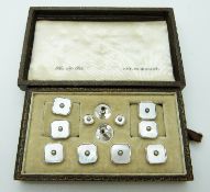 A set of silver studs and cufflinks set with mother of pearl,