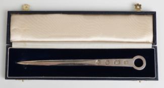 A cased modern feature hallmarked silver letter opener formed as a meat skewer,