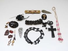 Victorian jet piece set with seed pearls in a yellow metal cross surround,