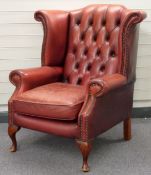 Leather wing-backed armchair